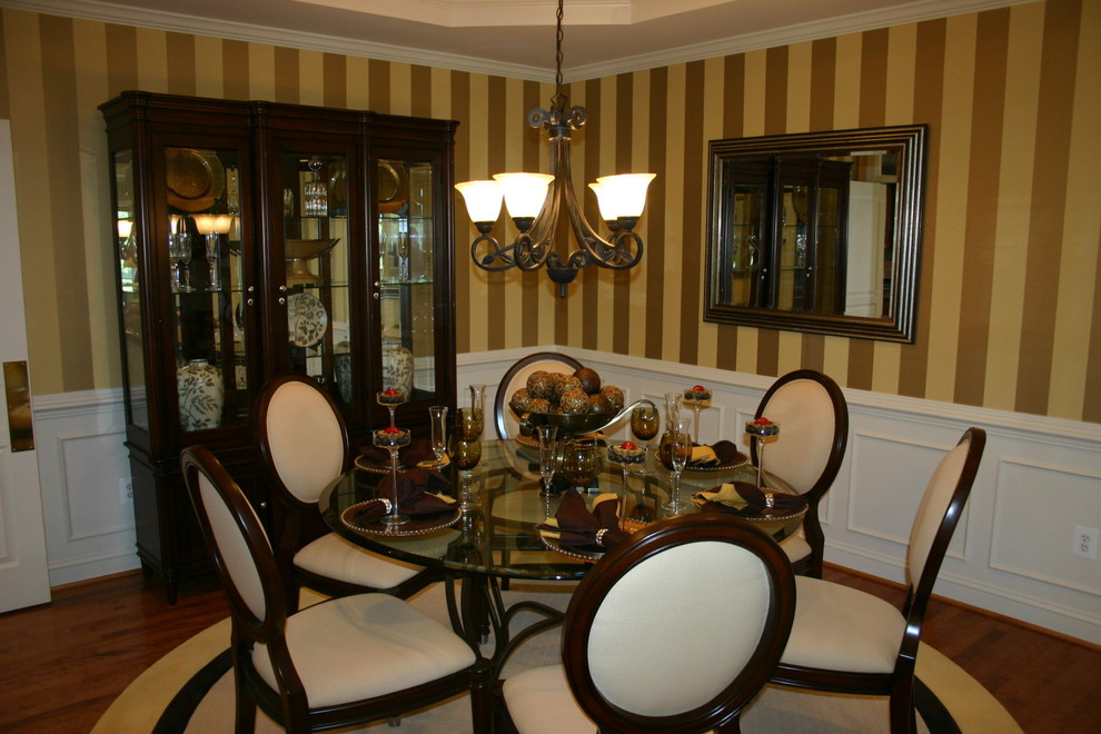 Photo of a traditional dining room in Baltimore with multi-coloured walls and dark hardwood floors.