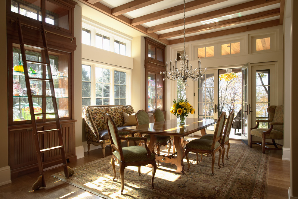 Photo of a dining room in Minneapolis with dark hardwood floors.