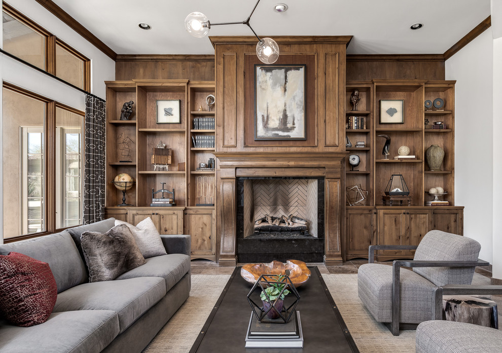 Inspiration for a transitional living room in Phoenix with a library and a standard fireplace.