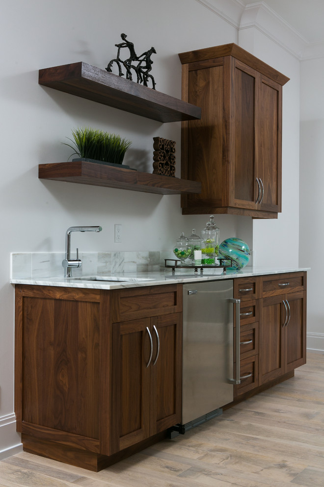 Small transitional single-wall light wood floor eat-in kitchen photo in Miami with an undermount sink, shaker cabinets, dark wood cabinets, marble countertops, gray backsplash, stone tile backsplash and stainless steel appliances