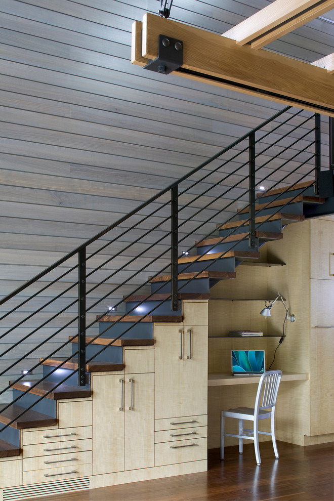 This is an example of a contemporary wood straight staircase in Denver with metal risers.