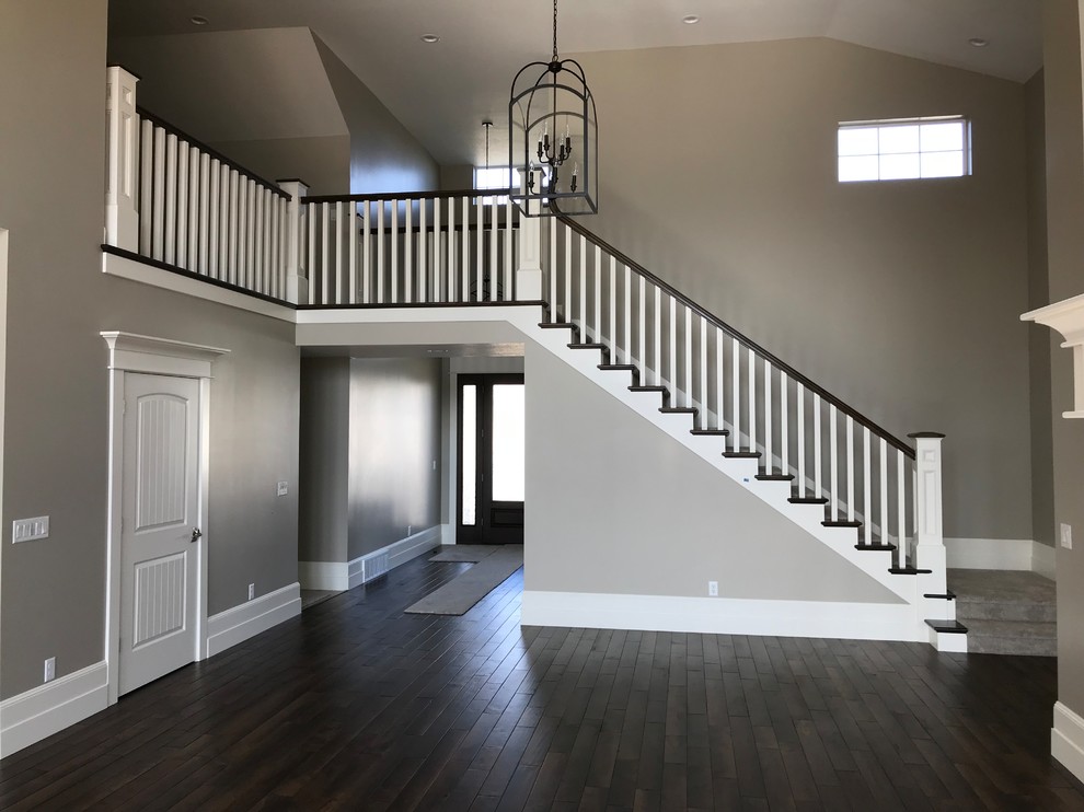 Inspiration for a mid-sized transitional wood u-shaped staircase in Salt Lake City with wood risers and wood railing.