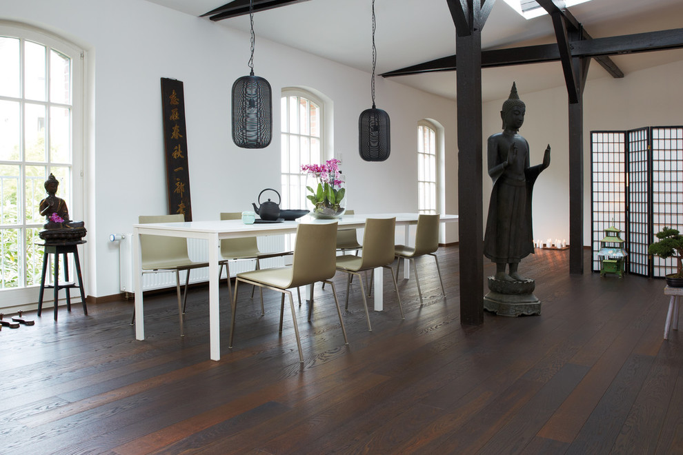 Photo of a large asian dining room in Other with medium hardwood floors and brown floor.