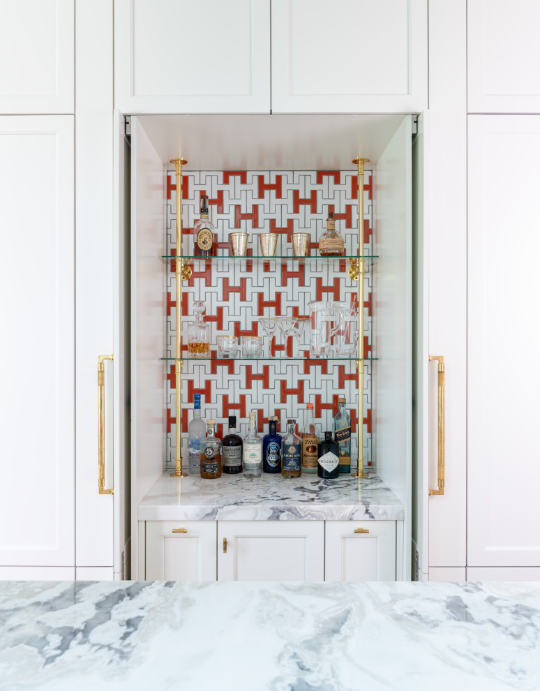 Example of a transitional home bar design in Dallas