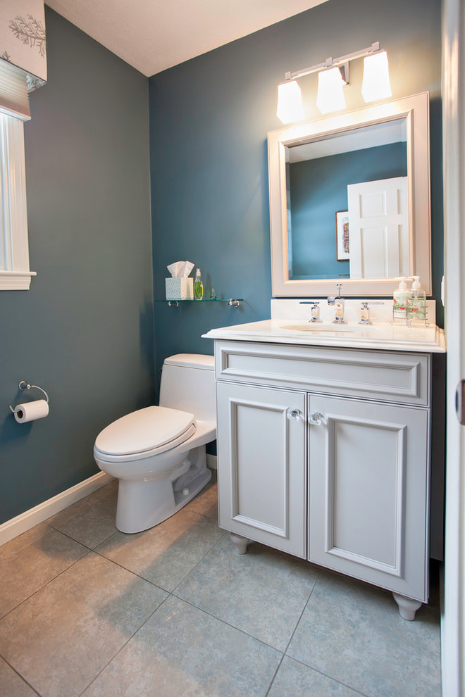Small arts and crafts 3/4 bathroom in Boston with recessed-panel cabinets, white cabinets, a one-piece toilet, green walls, ceramic floors and solid surface benchtops.