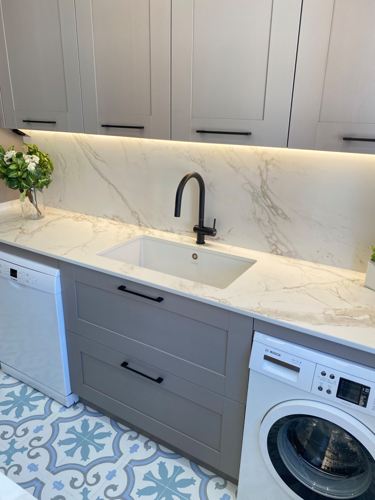 This is an example of a large traditional u-shaped enclosed kitchen in Other with a submerged sink, beaded cabinets, pink cabinets, marble worktops, white splashback, marble splashback, coloured appliances, porcelain flooring, multiple islands, multi-coloured floors and white worktops.