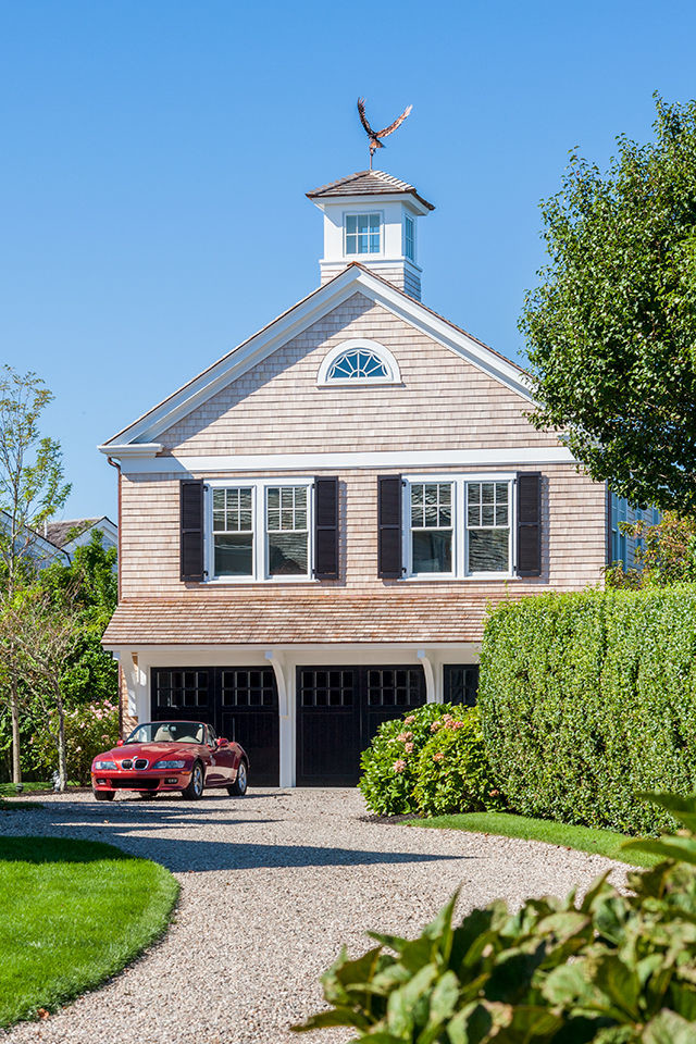 Design ideas for a beach style detached three-car workshop in Boston.