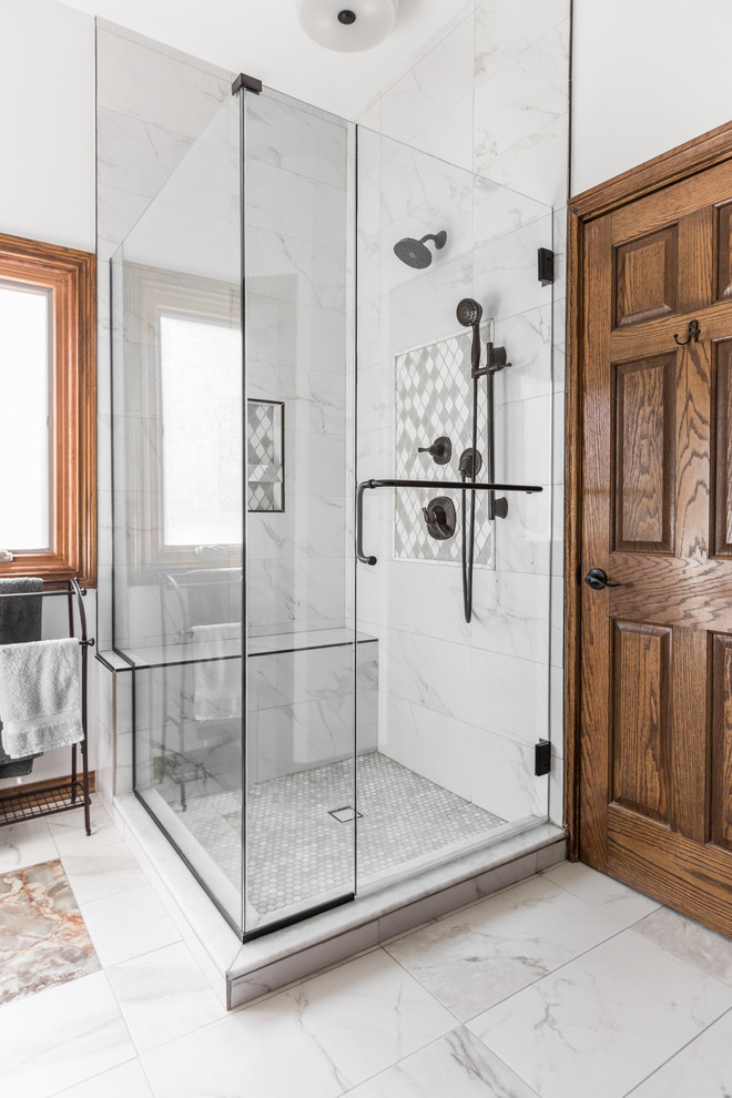 Design ideas for a large contemporary master bathroom in Indianapolis with raised-panel cabinets, medium wood cabinets, a corner shower, white tile, porcelain tile, white walls, porcelain floors, an undermount sink, quartzite benchtops, white floor, a hinged shower door and white benchtops.