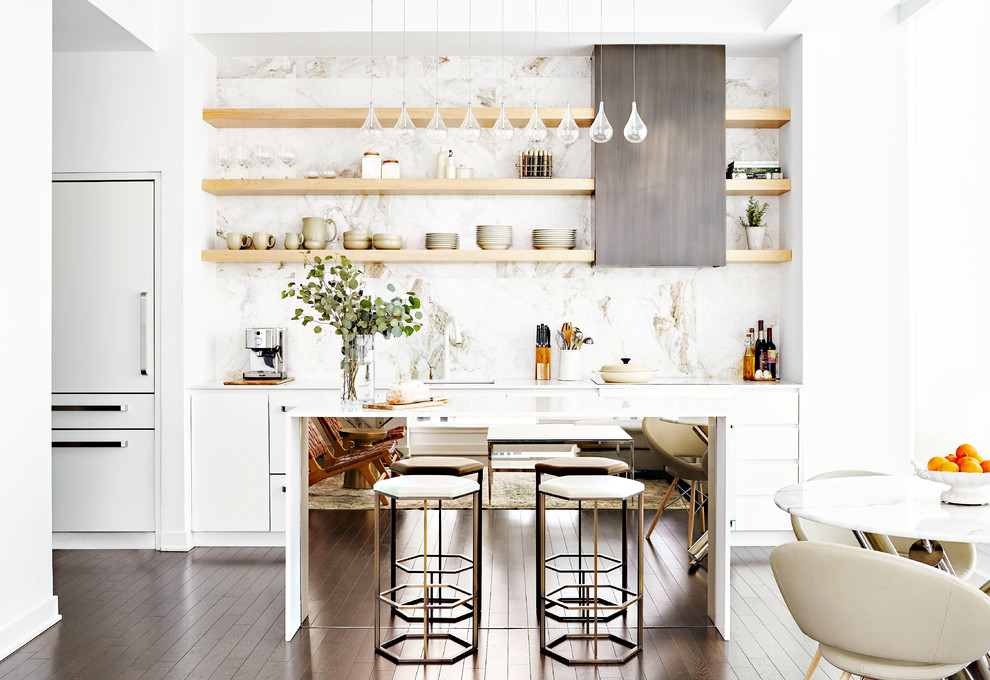 Contemporary single-wall eat-in kitchen in Toronto with an undermount sink, flat-panel cabinets, white cabinets, marble splashback, dark hardwood floors, with island, brown floor, white benchtop, multi-coloured splashback, panelled appliances and quartzite benchtops.