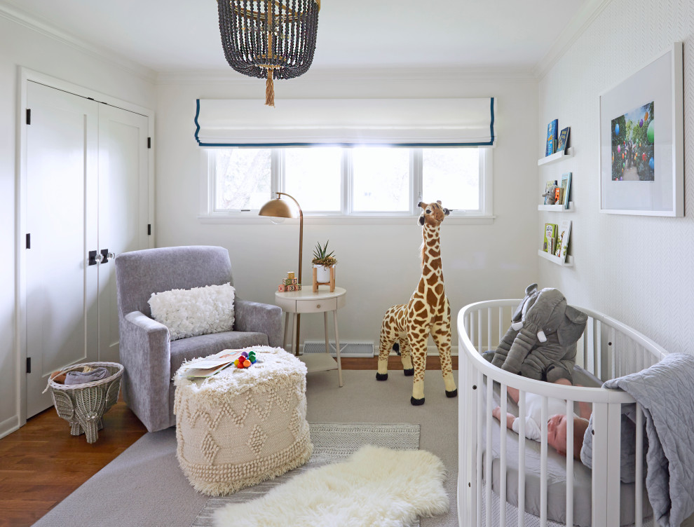 This is an example of a mid-sized transitional gender-neutral nursery in Chicago with multi-coloured walls, medium hardwood floors, brown floor and wallpaper.