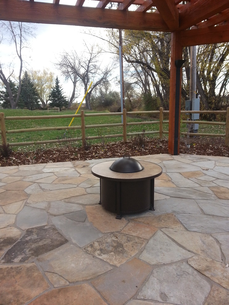 Example of a mountain style home design design in Denver