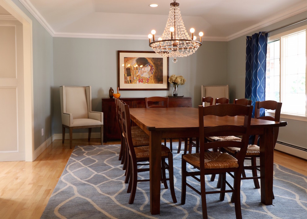 Design ideas for a large industrial separate dining room in Boston with blue walls and light hardwood floors.