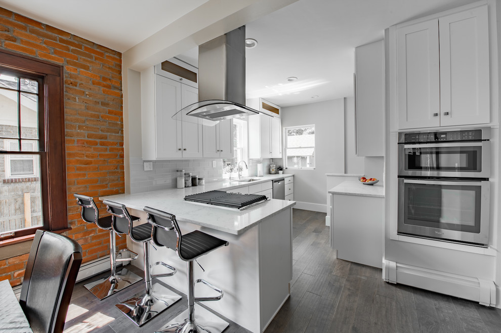 Example of a transitional kitchen design in Denver