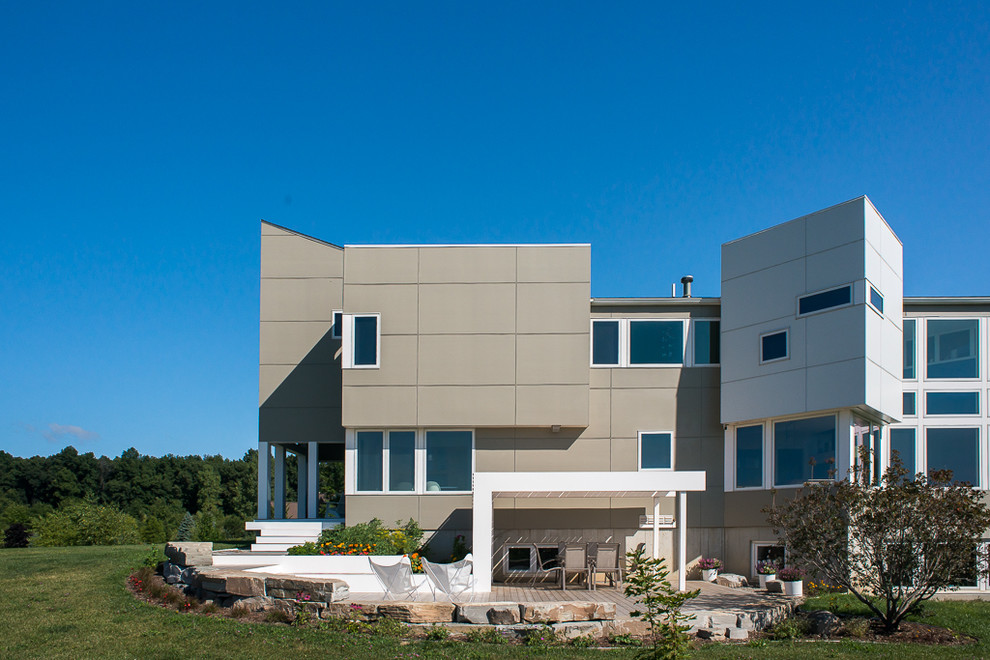 This is an example of a mid-sized contemporary two-storey exterior in Detroit.