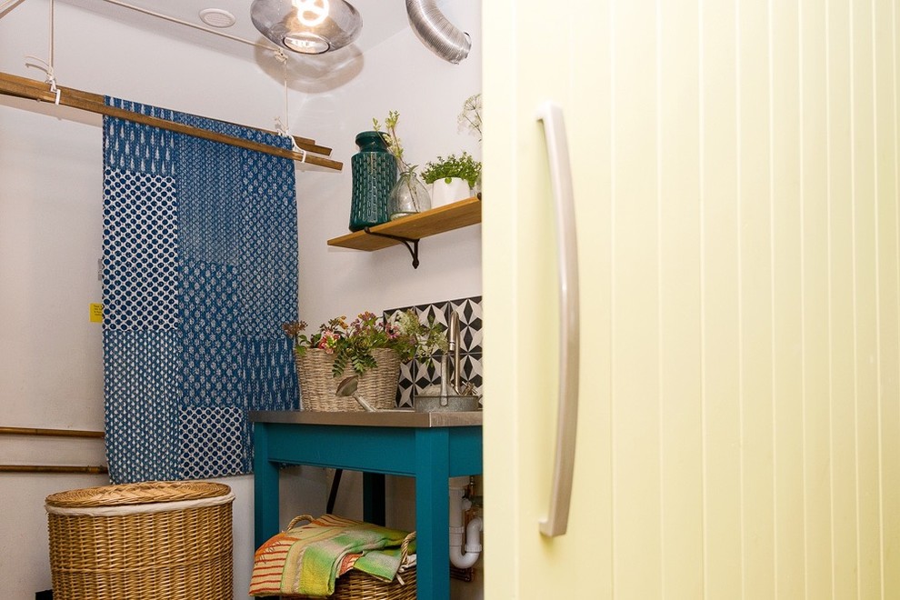Photo of an eclectic laundry room in Other.