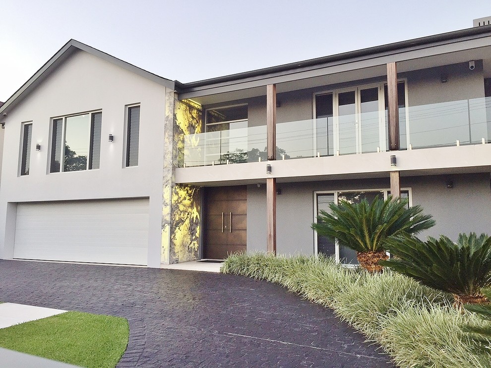 This is an example of a modern two-storey beige exterior in Sydney.