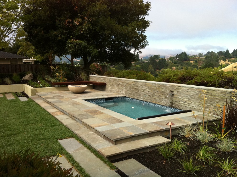 Inspiration for a transitional pool in San Francisco with a water feature.