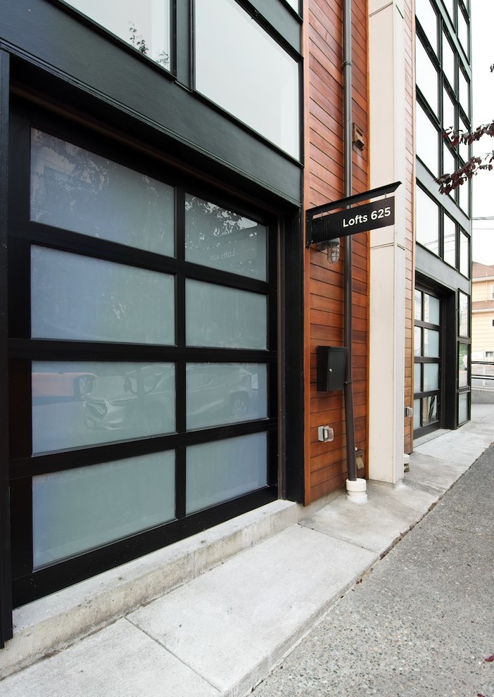 This is an example of a modern three-storey brown apartment exterior in Seattle.