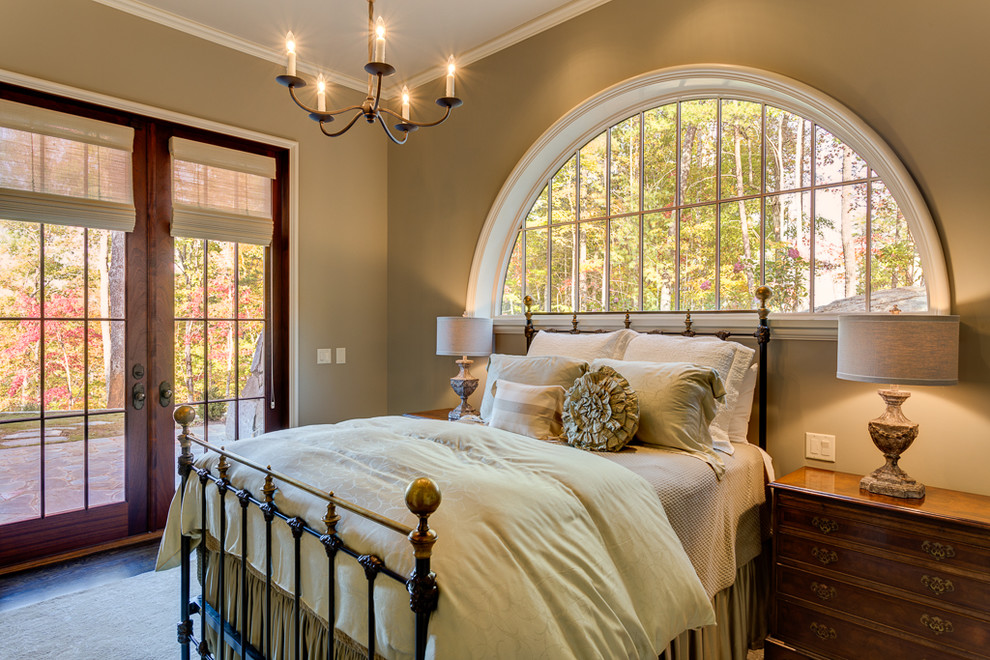 Photo of a mid-sized mediterranean guest bedroom in Other with dark hardwood floors.