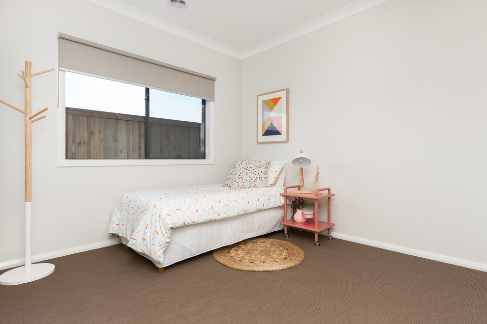 This is an example of a mid-sized contemporary guest bedroom in Melbourne with grey walls, carpet and beige floor.