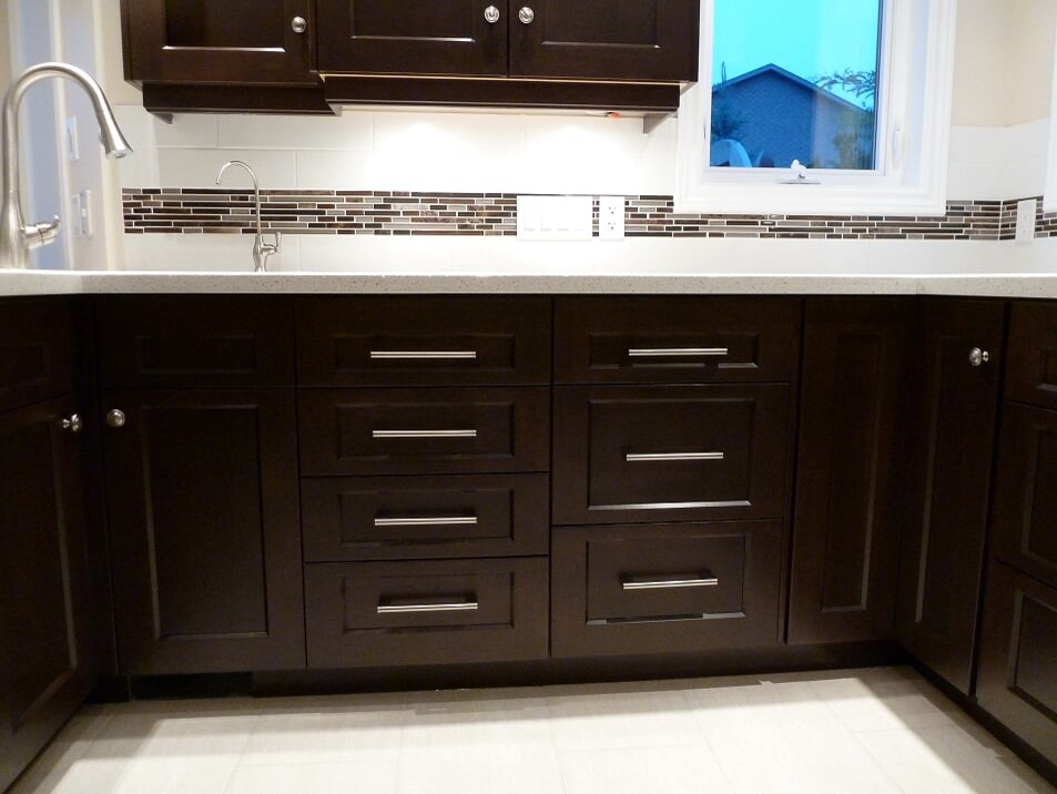 Transitional porcelain tile and beige floor eat-in kitchen photo in Toronto with a double-bowl sink, shaker cabinets, dark wood cabinets, quartz countertops, white backsplash, subway tile backsplash, stainless steel appliances and white countertops