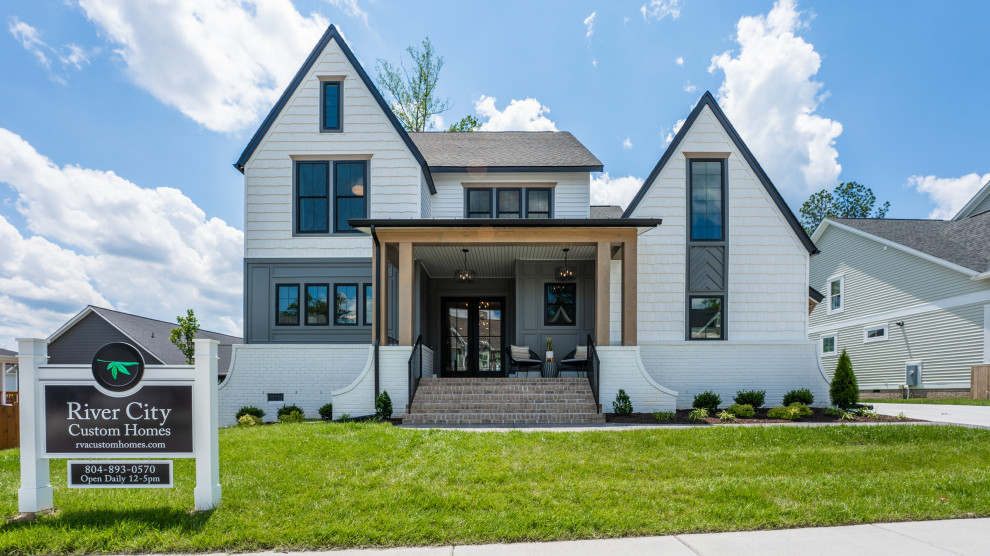 The Cardinal - Large transitional white three-story gable roof photo in Richmond with a mixed material roof and a black roof