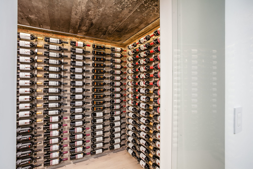 Mid-sized trendy light wood floor wine cellar photo in Toronto