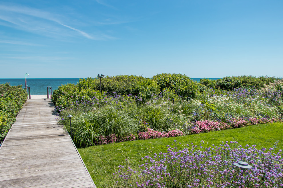 Inspiration for a beach style backyard garden in New York with a garden path and decking.