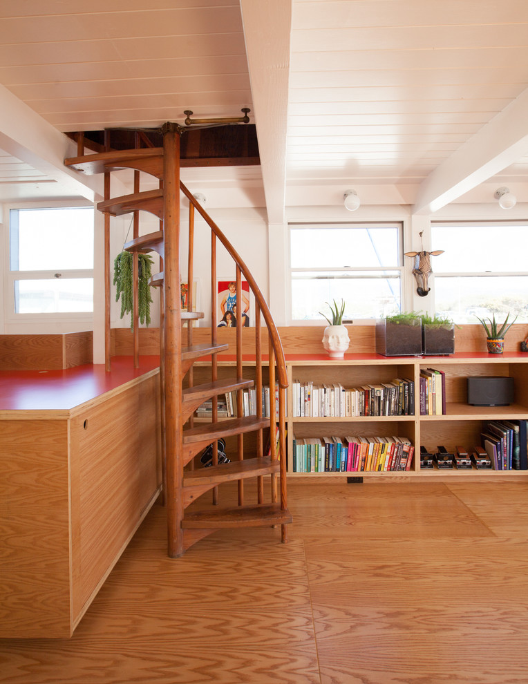 This is an example of a mid-sized scandinavian wood spiral staircase in San Francisco with open risers.
