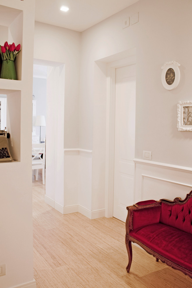 Mid-sized traditional foyer in Rome with grey walls, bamboo floors, a single front door and a white front door.