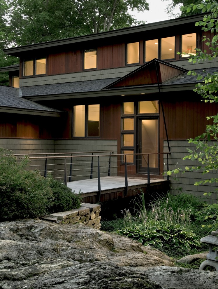 This is an example of a contemporary entryway in Burlington with a glass front door.