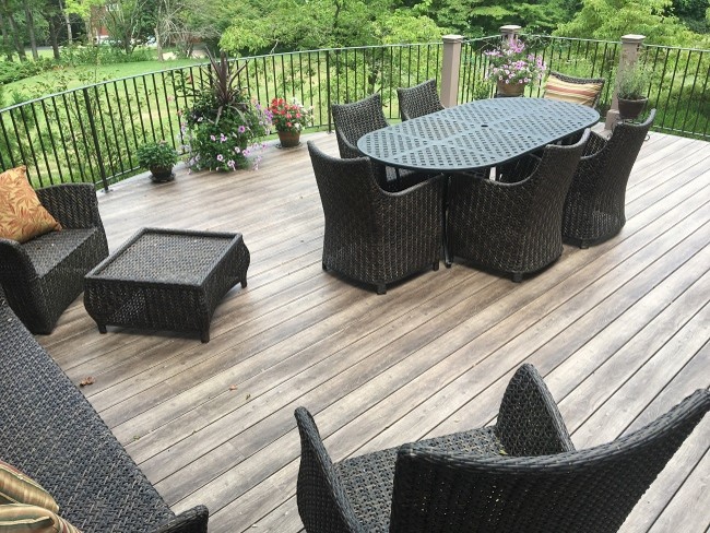 Design ideas for a large contemporary backyard deck in DC Metro with no cover.