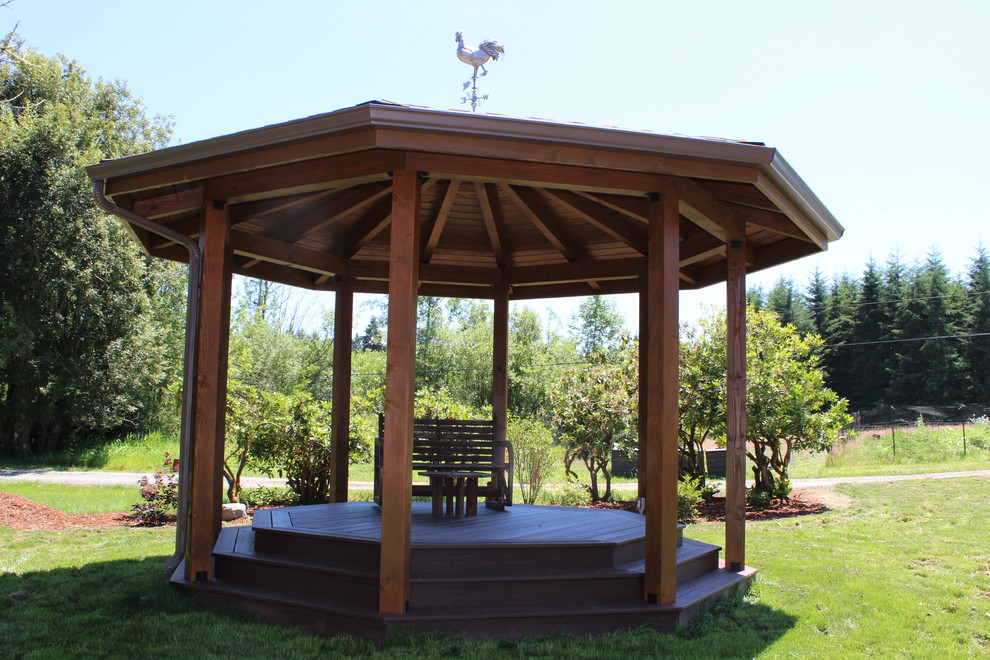 This is an example of a mid-sized traditional front yard patio in Seattle with decking and a gazebo/cabana.