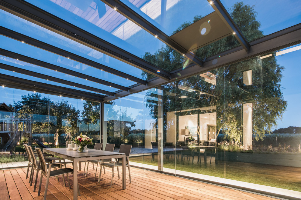 This is an example of a contemporary sunroom in Hertfordshire.