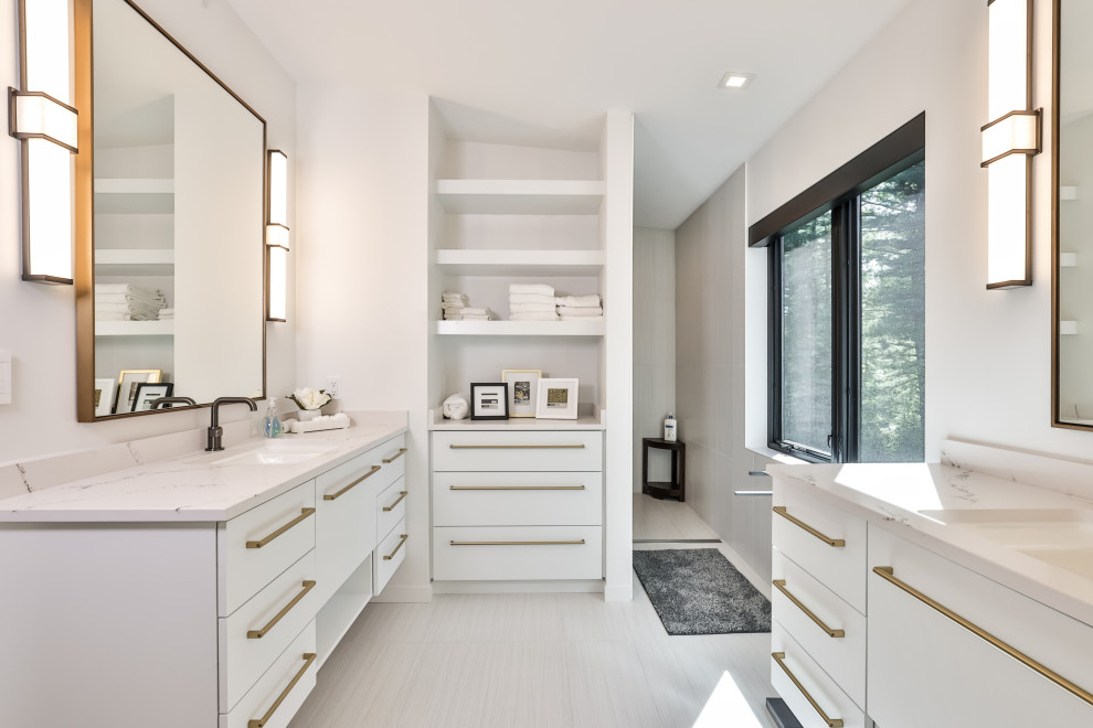 Photo of a modern master bathroom in Other with flat-panel cabinets, white cabinets, a curbless shower, white tile, porcelain tile, white walls, porcelain floors, an undermount sink, solid surface benchtops, white floor, an open shower, white benchtops, a single vanity and a floating vanity.