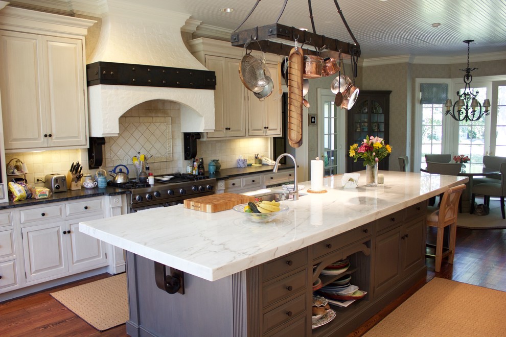 Example of a large transitional dark wood floor eat-in kitchen design in DC Metro with marble countertops, an island, white cabinets, white backsplash and stainless steel appliances