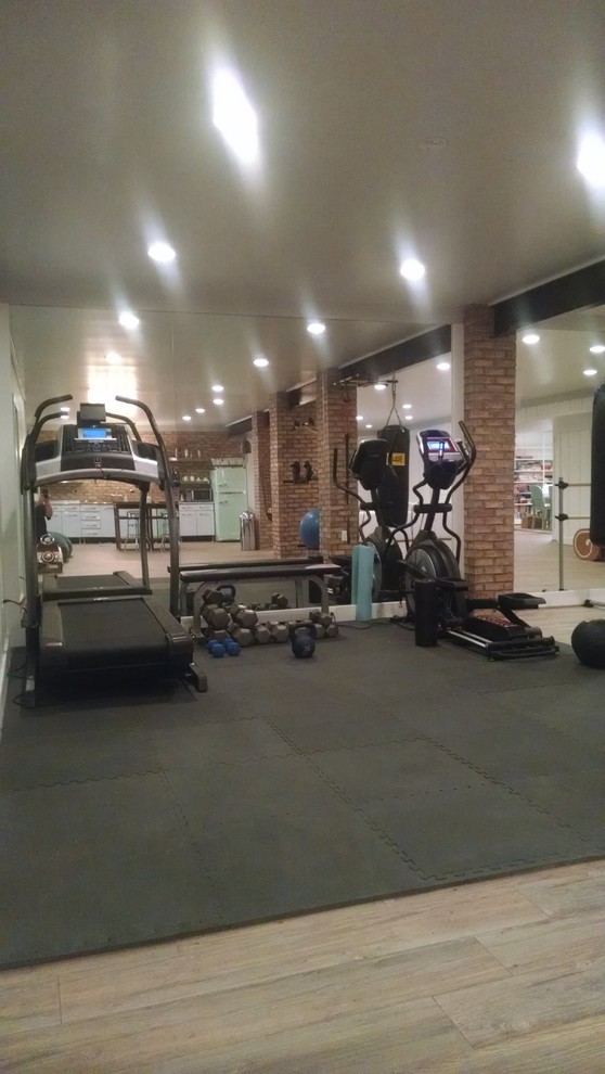 Mid-sized traditional multipurpose gym in DC Metro with white walls, light hardwood floors and grey floor.