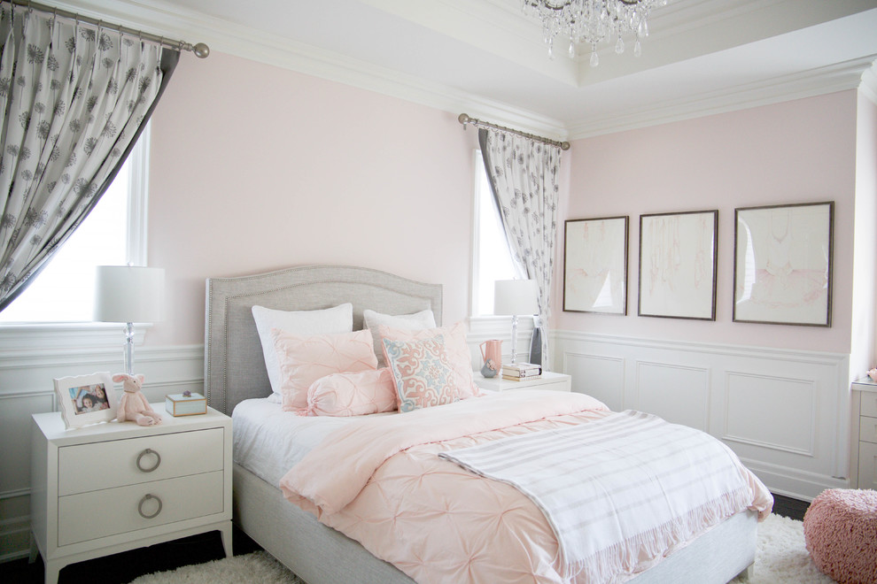 Large traditional guest bedroom in Toronto with pink walls, dark hardwood floors and brown floor.