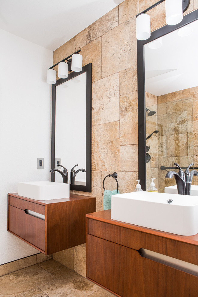 Design ideas for a mid-sized contemporary 3/4 bathroom in Denver with flat-panel cabinets, dark wood cabinets, an alcove shower, a one-piece toilet, beige tile, travertine, white walls, travertine floors, a vessel sink, wood benchtops, multi-coloured floor, an open shower and brown benchtops.
