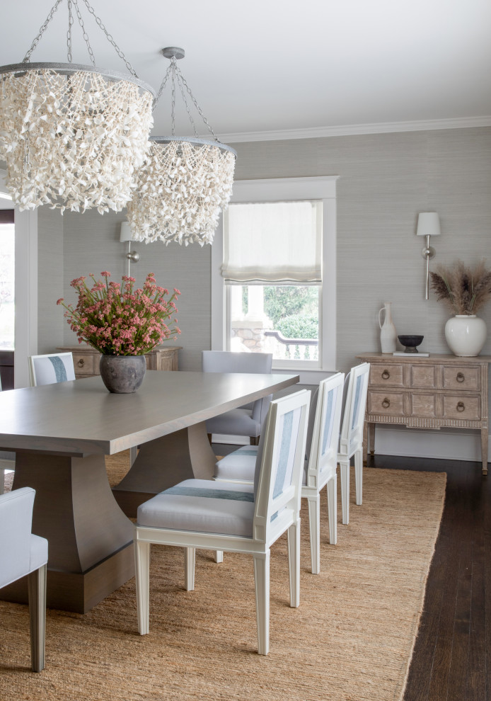 Design ideas for a traditional dining room in New York with grey walls, dark hardwood floors and wallpaper.