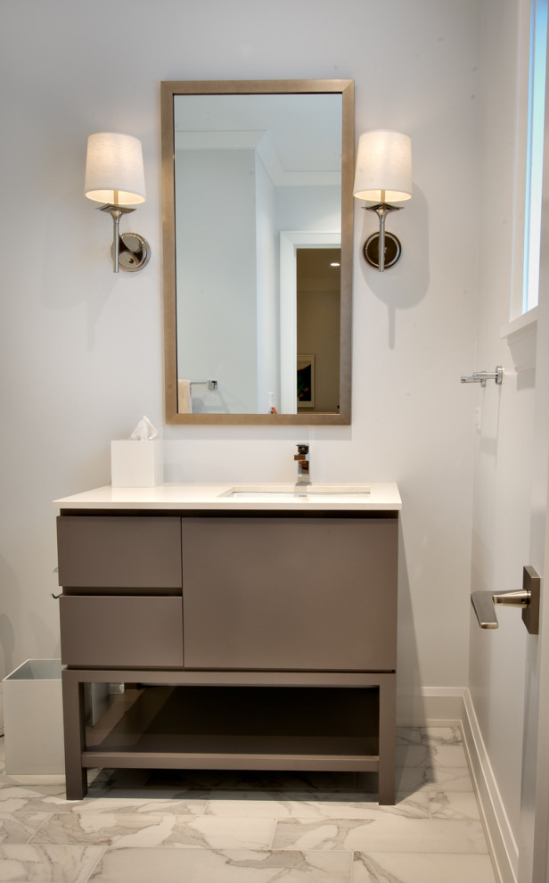 Contemporary bathroom in Chicago with flat-panel cabinets, grey cabinets, grey walls, porcelain floors, a drop-in sink, concrete benchtops, multi-coloured floor, white benchtops, a single vanity and a freestanding vanity.