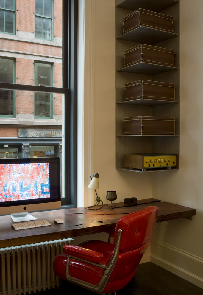 Inspiration for an industrial home office in New York with a built-in desk.