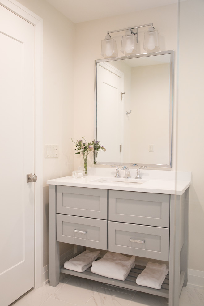 Inspiration for a small arts and crafts 3/4 bathroom in Milwaukee with recessed-panel cabinets, grey cabinets, an alcove shower, a two-piece toilet, white tile, white walls, porcelain floors, an undermount sink, engineered quartz benchtops, white floor, a hinged shower door and yellow benchtops.