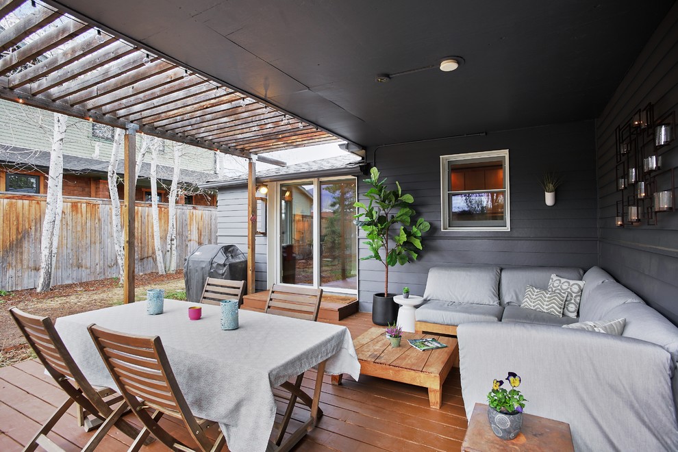Inspiration for a mid-sized contemporary backyard deck in Denver with a pergola.