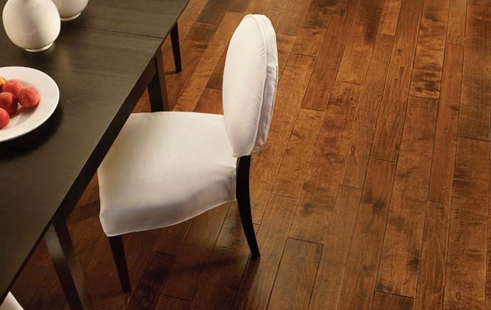 Large transitional medium tone wood floor and brown floor enclosed dining room photo with no fireplace and beige walls