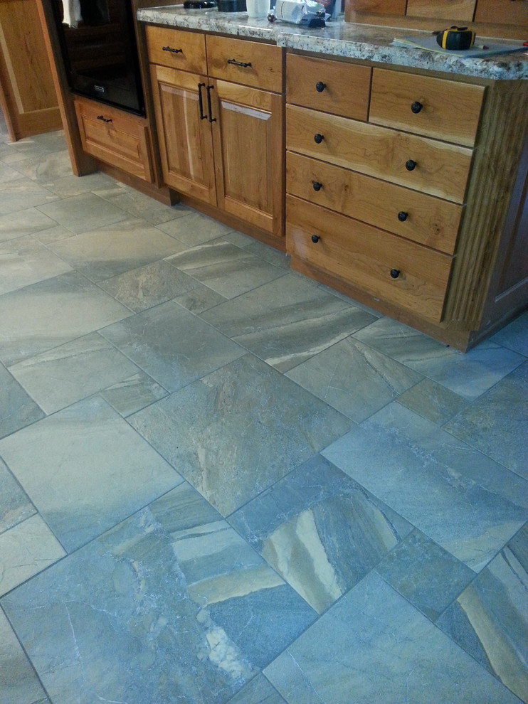 Mountain style kitchen photo in Austin with flat-panel cabinets and medium tone wood cabinets