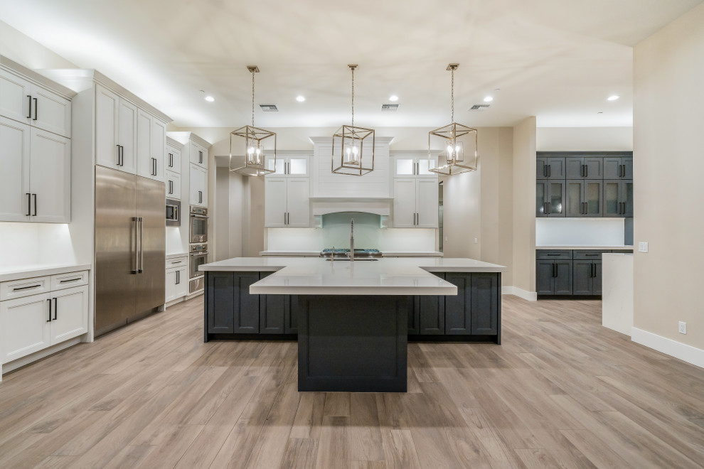 Inspiration for a large modern u-shaped open concept kitchen remodel in Phoenix with an island