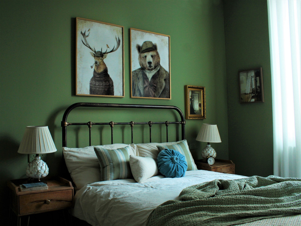 Small eclectic master bedroom in Edinburgh with green walls, carpet, no fireplace and white floor.