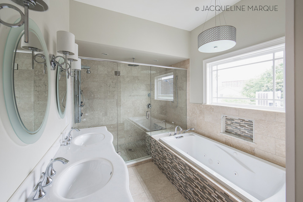 Large transitional master bathroom in New Orleans with an undermount sink, furniture-like cabinets, dark wood cabinets, marble benchtops, a drop-in tub, a double shower, a two-piece toilet, multi-coloured tile, stone tile, green walls and travertine floors.