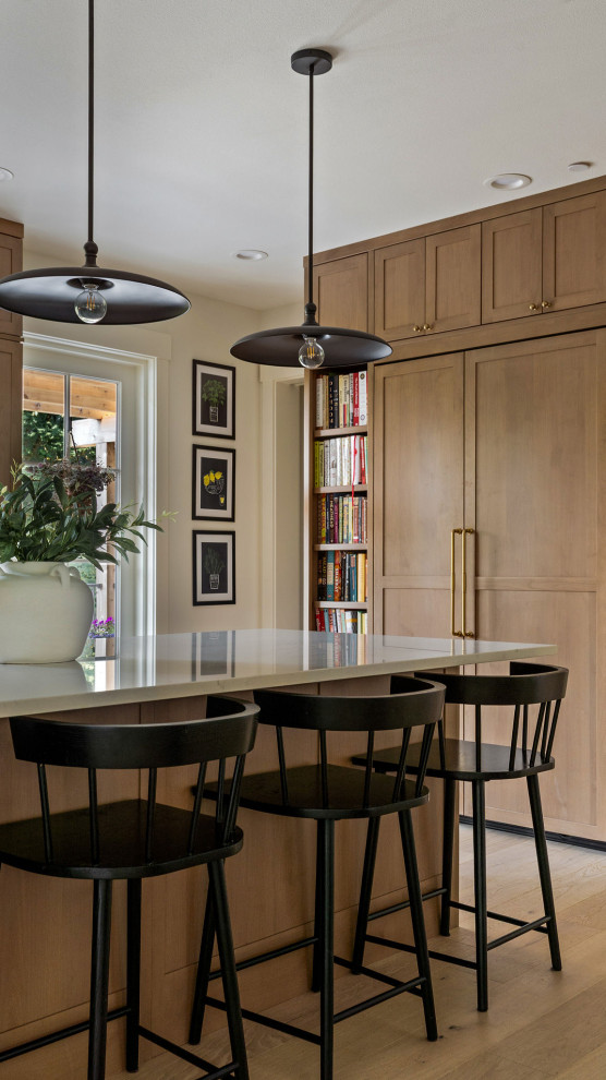 Example of a transitional home bar design in Seattle